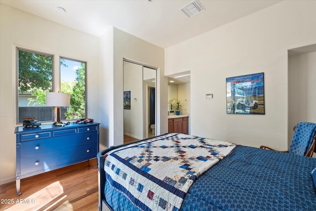 14037 E Coyote Rd, Scottsdale, AZ 85259 - bedroom with visible vents, light wood-style flooring, and baseboards