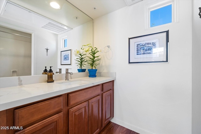 14037 E Coyote Rd, Scottsdale, AZ 85259 - bathroom with wood finished floors, vanity, and baseboards