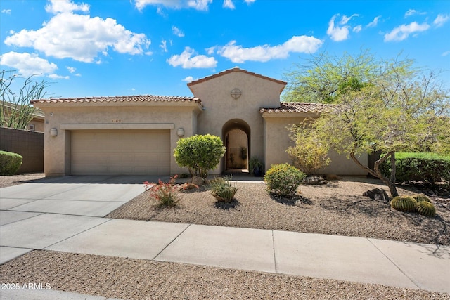 14037 E Coyote Rd, Scottsdale, AZ 85259 - mediterranean / spanish house featuring driveway, stucco siding, a tiled roof, and an attached garage