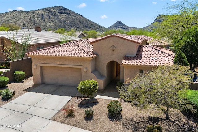 14037 E Coyote Rd, Scottsdale, AZ 85259 - mediterranean / spanish home with stucco siding, a mountain view, driveway, a garage, and a tiled roof