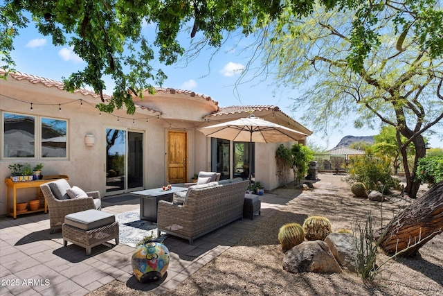14037 E Coyote Rd, Scottsdale, AZ 85259 - rear view of house with a patio area, a tiled roof, an outdoor hangout area, and stucco siding