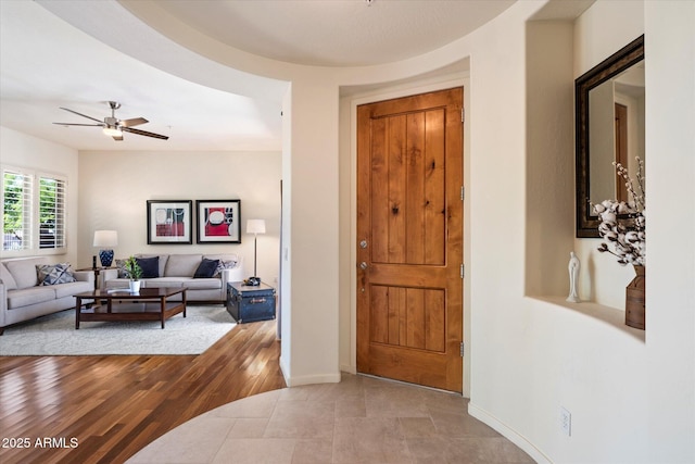 14037 E Coyote Rd, Scottsdale, AZ 85259 - entrance foyer featuring light wood-style floors, ceiling fan, and baseboards