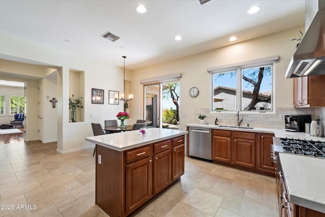 14037 E Coyote Rd, Scottsdale, AZ 85259 - kitchen with range hood, stainless steel dishwasher, tasteful backsplash, visible vents, and a sink