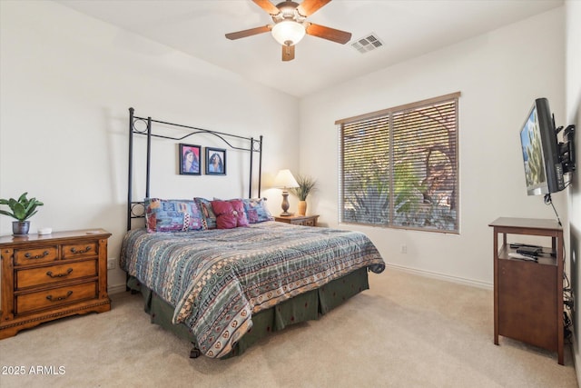 bedroom with light carpet and ceiling fan