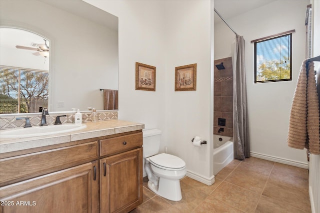 full bathroom with ceiling fan, tile patterned flooring, vanity, toilet, and shower / bath combo with shower curtain