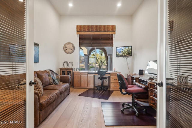 office area with french doors and light wood-type flooring