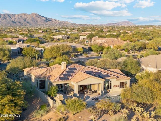 birds eye view of property featuring a mountain view