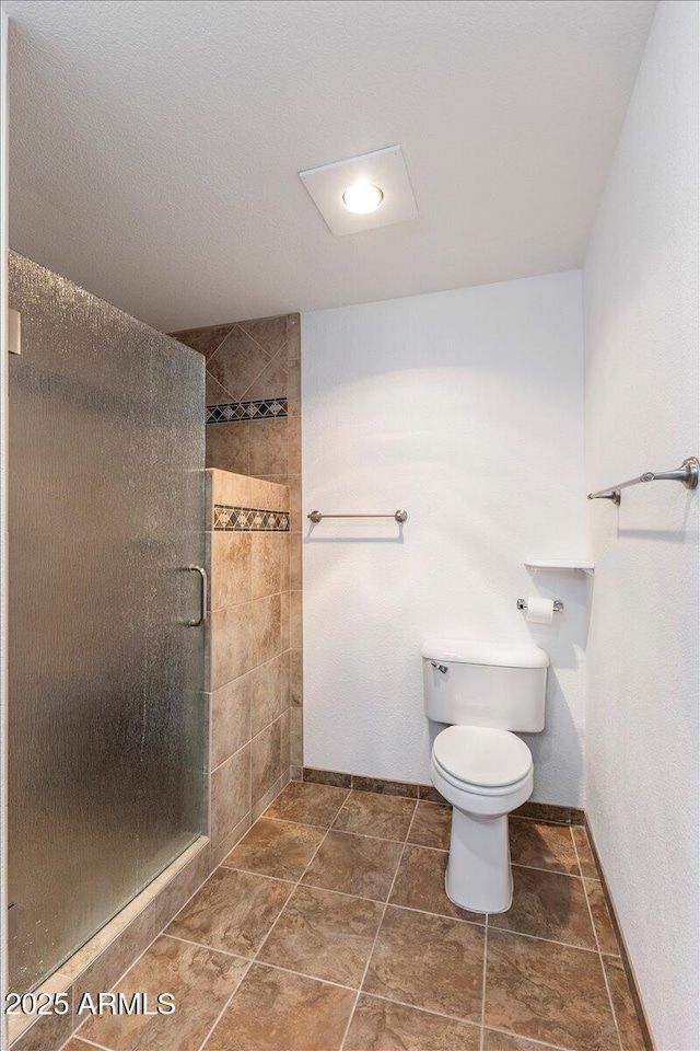 118 S 700th St E, Taylor, AZ 85939 - bathroom with a shower stall, toilet, and baseboards