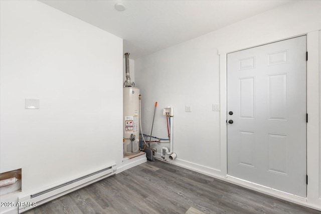 118 S 700th St E, Taylor, AZ 85939 - laundry room with a baseboard radiator, gas water heater, wood finished floors, and baseboards