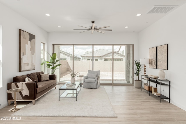 living room featuring visible vents, wood finished floors, ceiling fan, and recessed lighting