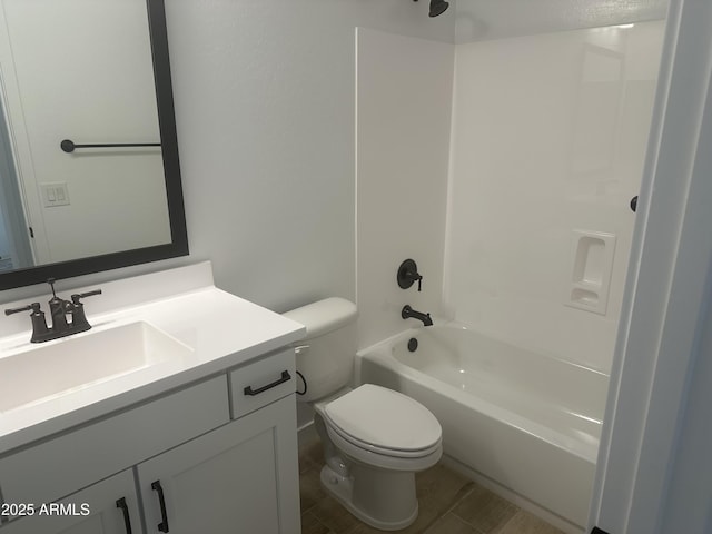 full bathroom featuring tub / shower combination, wood finished floors, toilet, and vanity