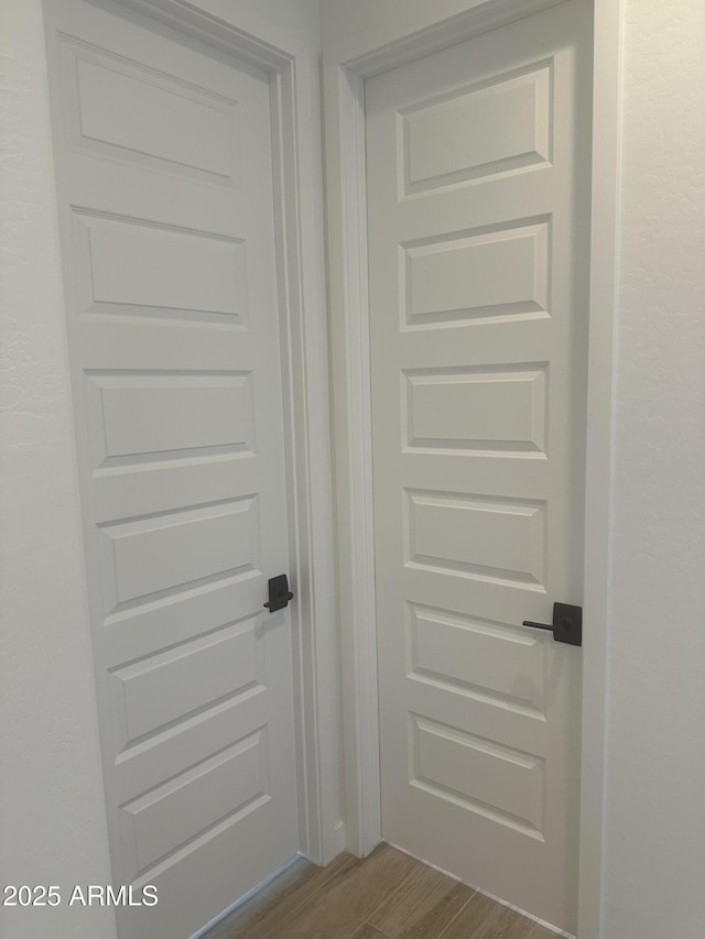 doorway featuring dark wood-style flooring