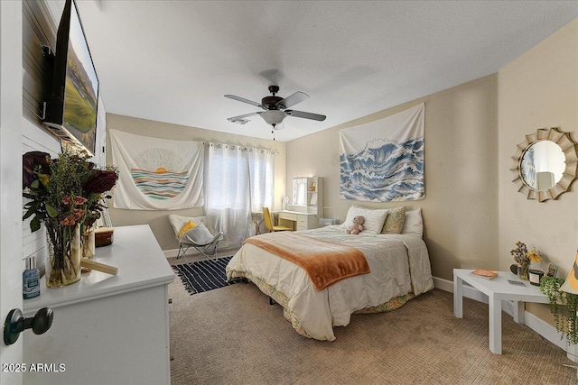 bedroom with baseboards, light colored carpet, and ceiling fan