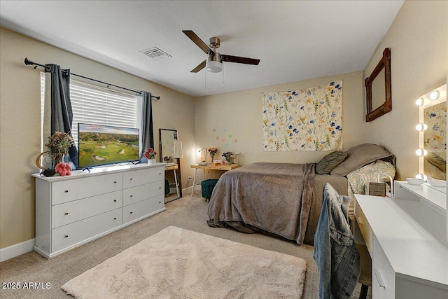 bedroom featuring baseboards, ceiling fan, light colored carpet, and visible vents