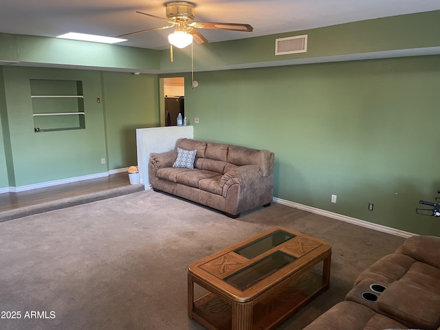3115 N 26th St, Phoenix, AZ 85016 - carpeted living room with ceiling fan and baseboards