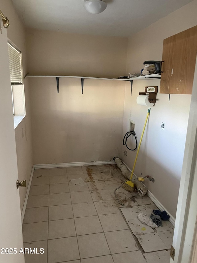 3115 N 26th St, Phoenix, AZ 85016 - laundry area with washer hookup, baseboards, and light tile patterned floors