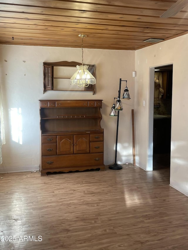 3115 N 26th St, Phoenix, AZ 85016 - bedroom featuring wood ceiling, wood finished floors, and baseboards