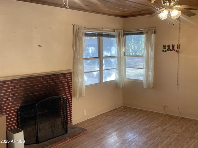 3115 N 26th St, Phoenix, AZ 85016 - unfurnished living room with healthy amount of natural light, ceiling fan, wood finished floors, a fireplace, and wood ceiling