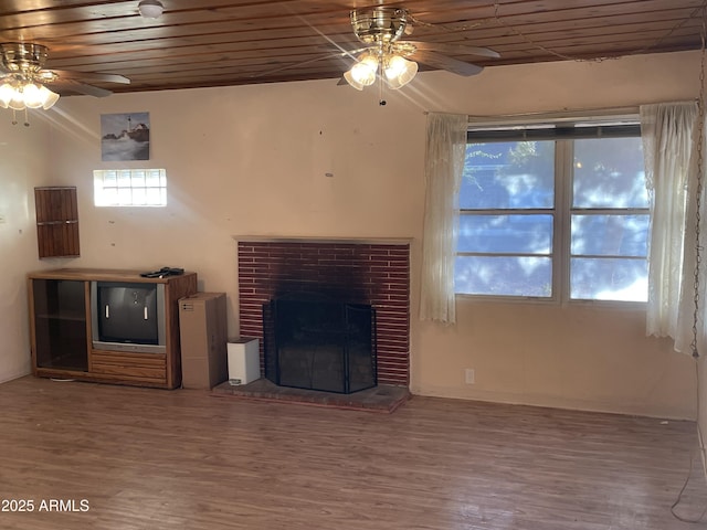 3115 N 26th St, Phoenix, AZ 85016 - unfurnished living room featuring a ceiling fan, wood finished floors, a brick fireplace, and wood ceiling