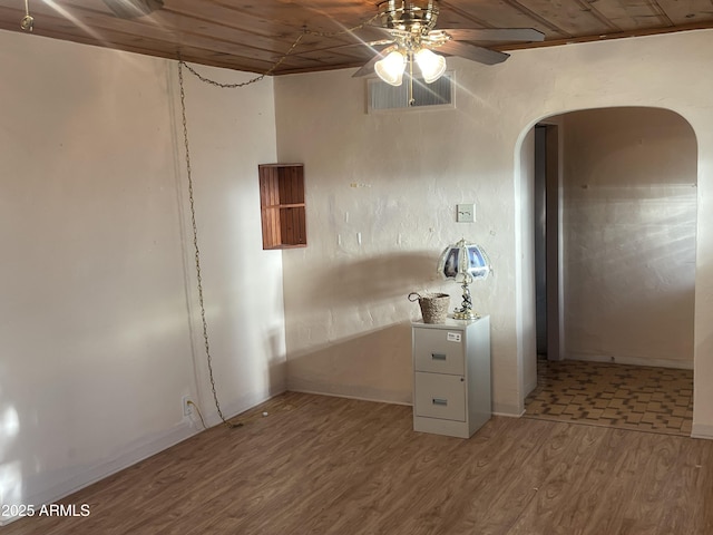 3115 N 26th St, Phoenix, AZ 85016 - spare room with ceiling fan, arched walkways, and wood finished floors