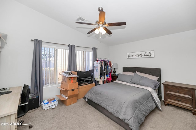 bedroom featuring ceiling fan, light colored carpet, and lofted ceiling