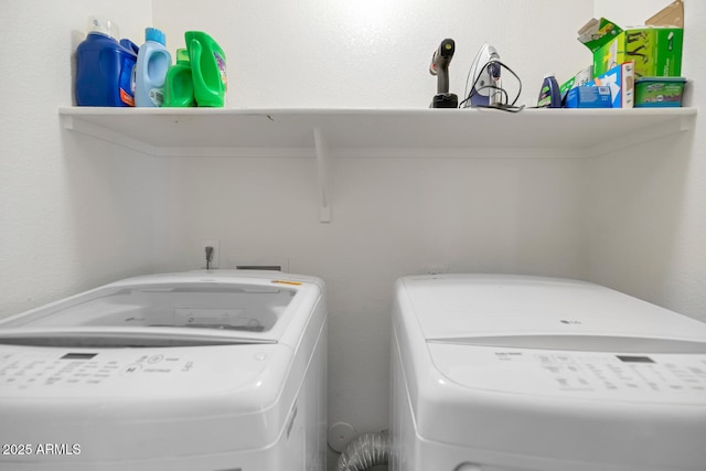 washroom with washing machine and clothes dryer