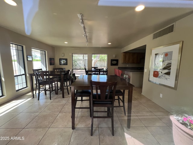 5203 N 24th St Unit 207, Phoenix, AZ 85016 - dining room with light tile patterned flooring, healthy amount of natural light, track lighting, and recessed lighting