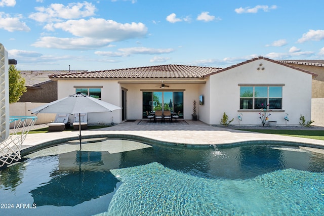 view of pool featuring ceiling fan and a patio