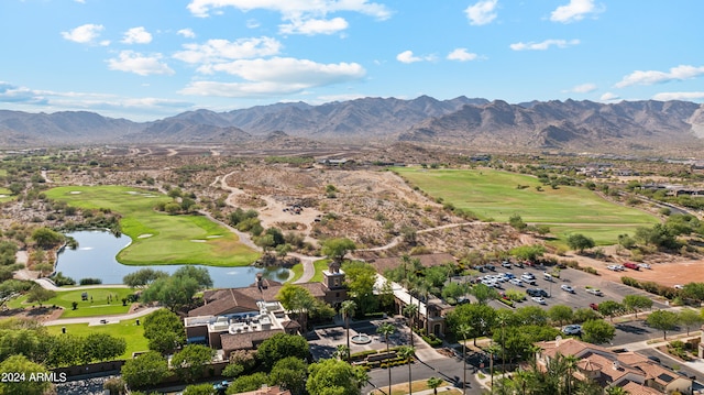 birds eye view of property with a water and mountain view