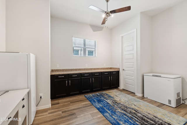 bathroom featuring ceiling fan, vanity, and hardwood / wood-style floors