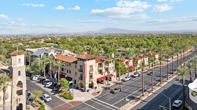 birds eye view of property with a mountain view