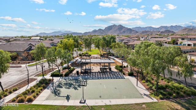 birds eye view of property with a mountain view