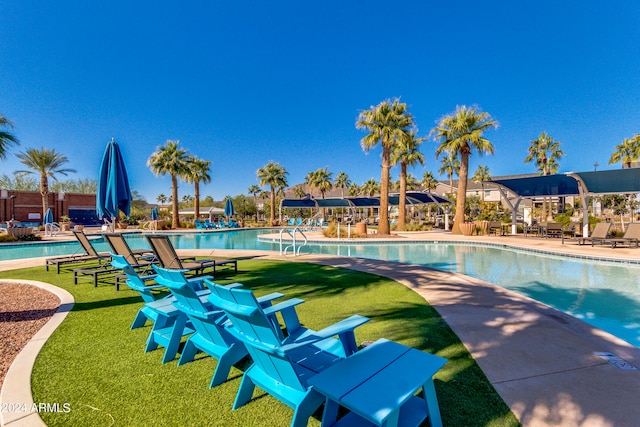 view of pool featuring a yard