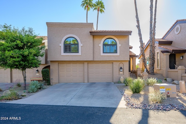 mediterranean / spanish-style home featuring a garage