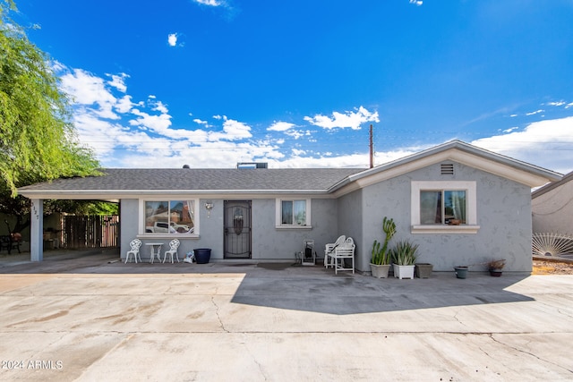 ranch-style home featuring a patio area