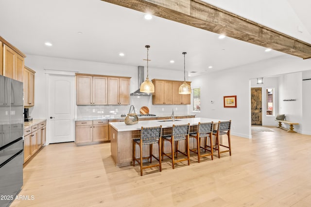 3441 S Del Aire Ct Unit 182, Flagstaff, AZ 86005 - kitchen with wall chimney exhaust hood, light countertops, plenty of natural light, a sink, and recessed lighting