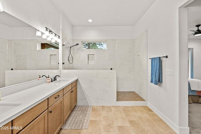 3441 S Del Aire Ct Unit 182, Flagstaff, AZ 86005 - full bathroom with double vanity, a marble finish shower, a ceiling fan, and recessed lighting