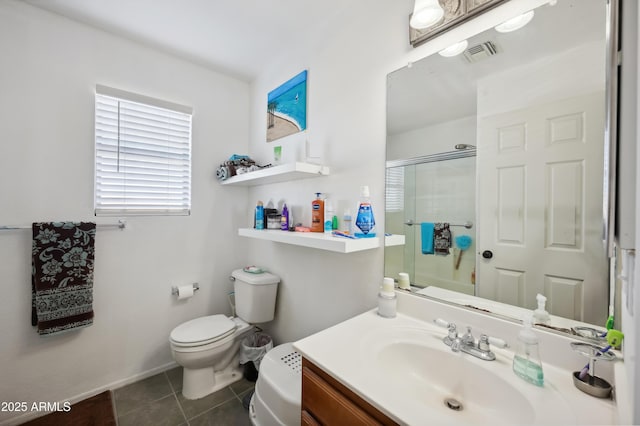 bathroom with a shower with shower door, tile patterned floors, vanity, and toilet