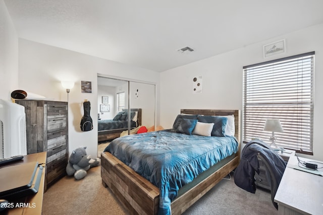 carpeted bedroom with a closet