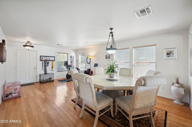 dining room with light hardwood / wood-style floors