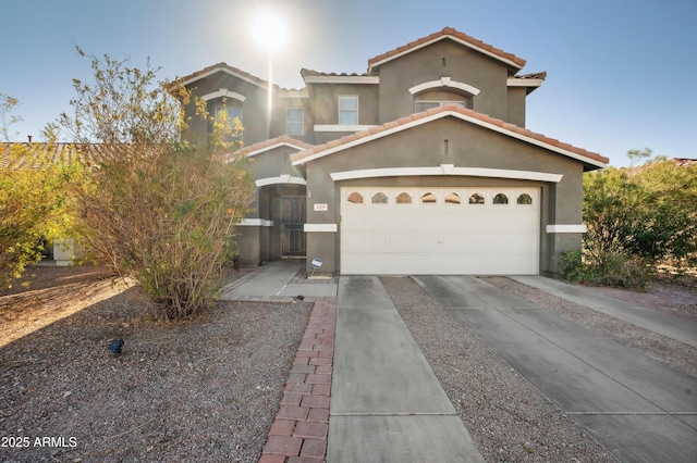 mediterranean / spanish home featuring a garage