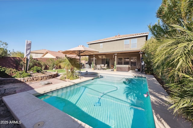 view of pool with a patio area and a jacuzzi