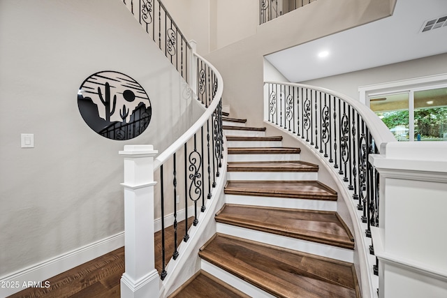 staircase featuring wood-type flooring