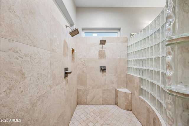 bathroom with tiled shower