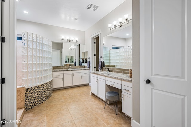 bathroom featuring tile patterned floors and vanity