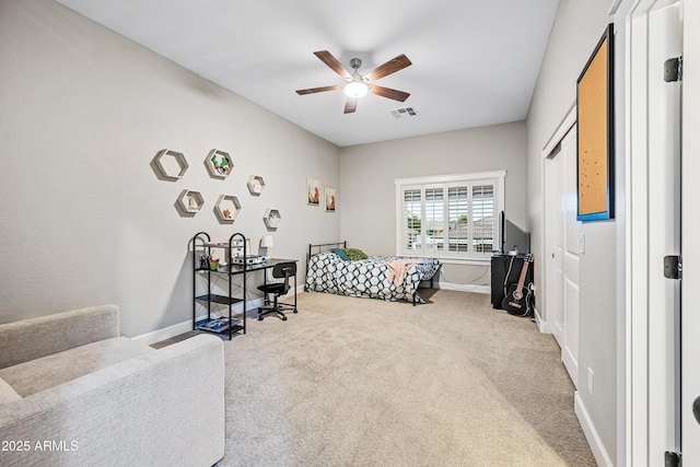 carpeted bedroom featuring ceiling fan