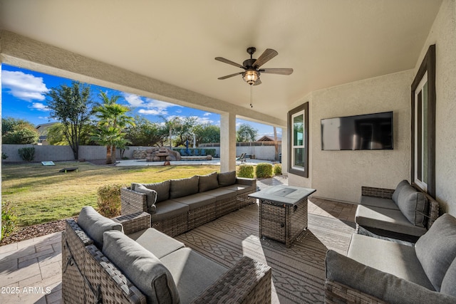 view of patio featuring an outdoor living space and ceiling fan