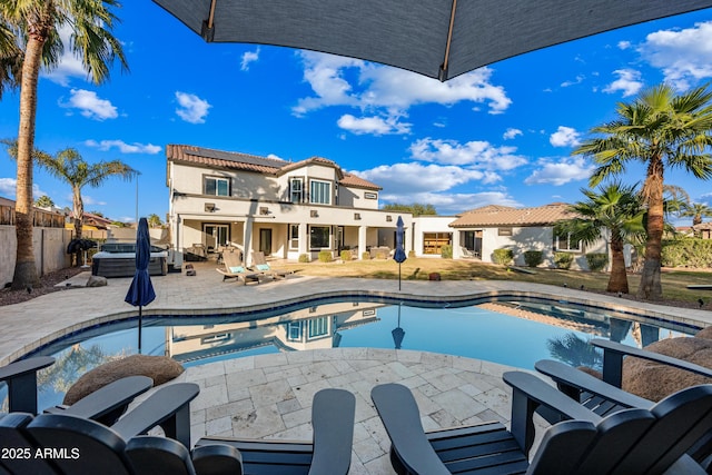 view of pool with a jacuzzi and a patio area