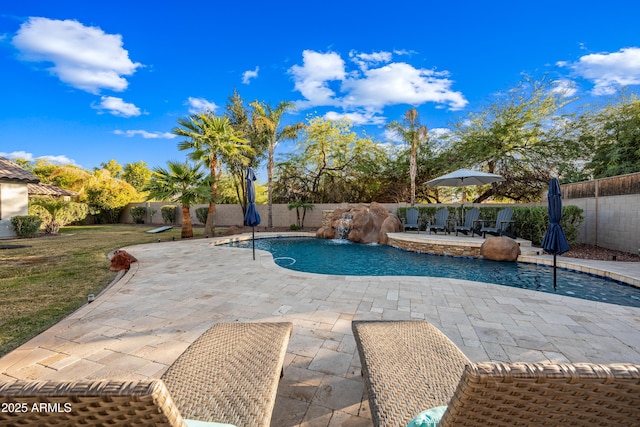 view of pool featuring pool water feature and a patio area