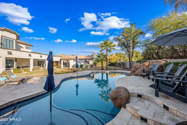 view of swimming pool featuring a patio